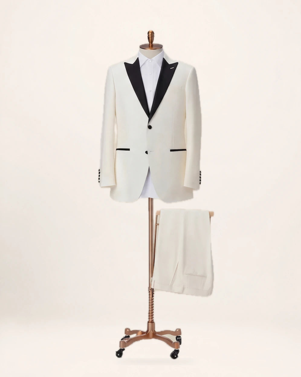 The Ascension Suit — ivory suit with black trim, jacket and trousers on a stand, front view