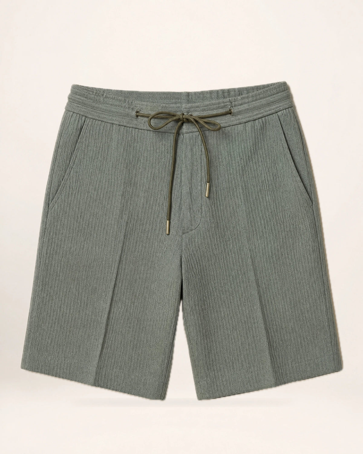 The Dune Short — grey-green shorts, front view