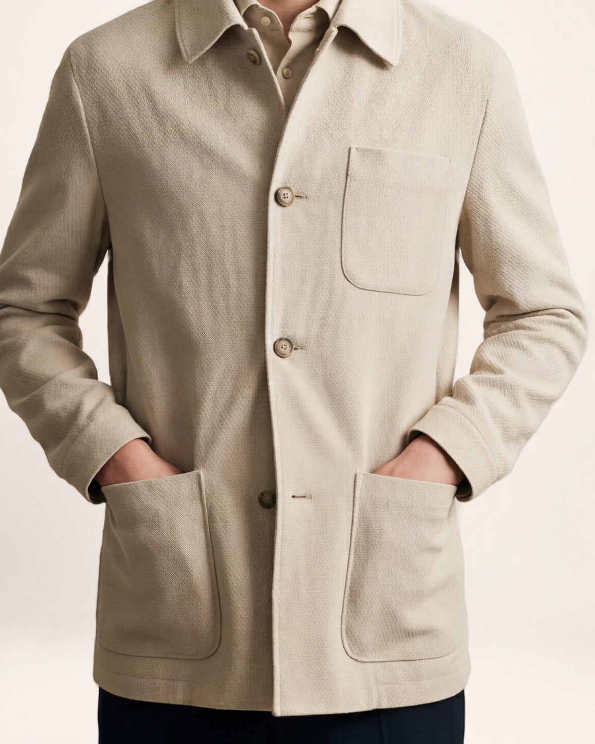 The Passage Jacket — beige button-front jacket, front view on a model
