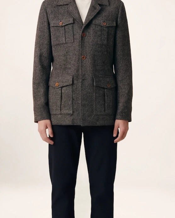 The Safari Jacket — charcoal jacket, front view on a model