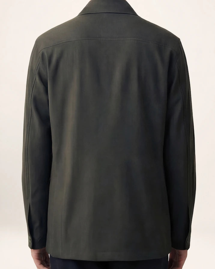 The Vanguard Jacket — dark olive field jacket, back view on a model