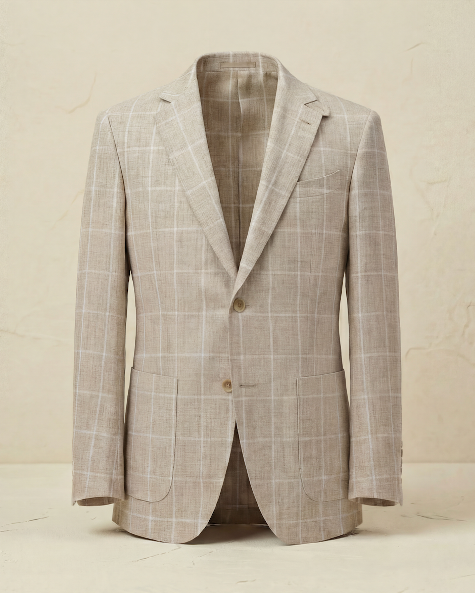 Light gray checkered blazer on a beige background