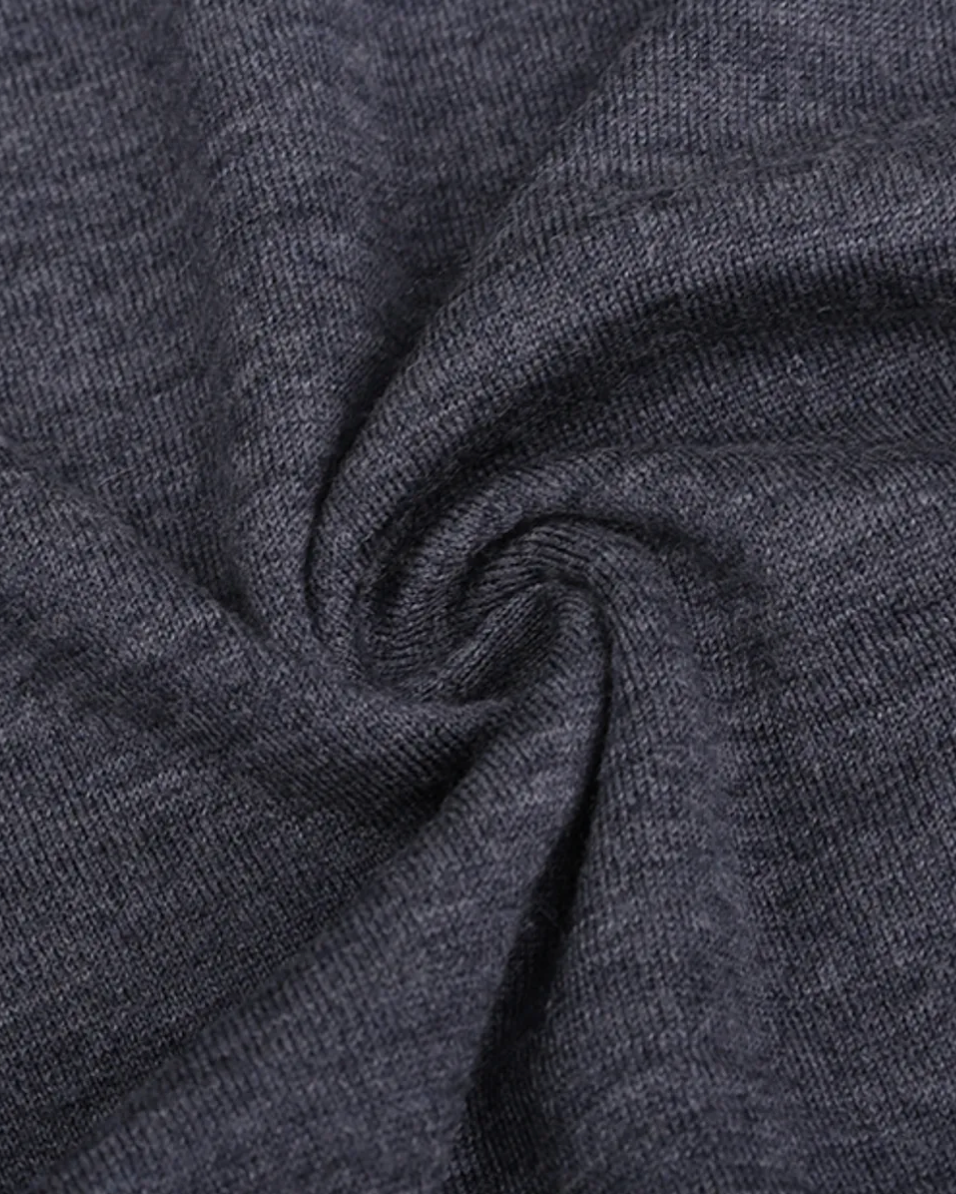 The Voyager Knit — grey crew-neck knit, gathered knit texture, close-up