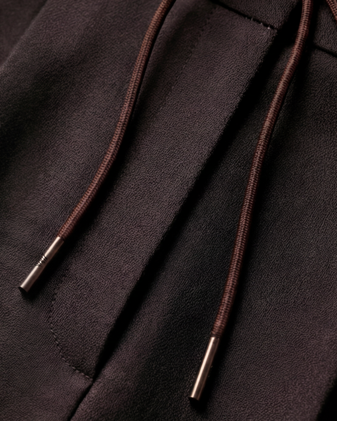 The Wayfarer Trouser — dark brown trousers, drawstring and pocket detail