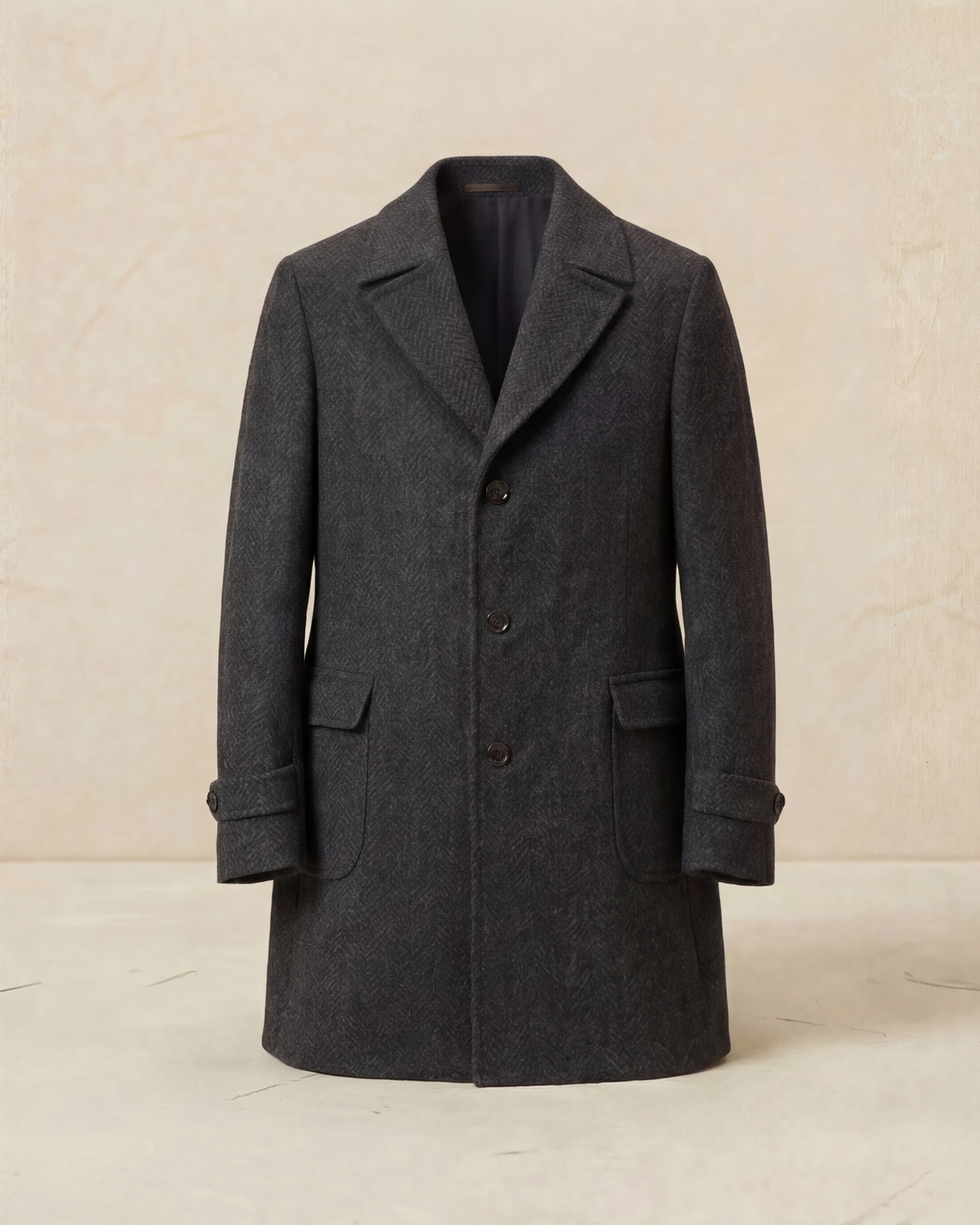 Dark gray coat on a beige background
