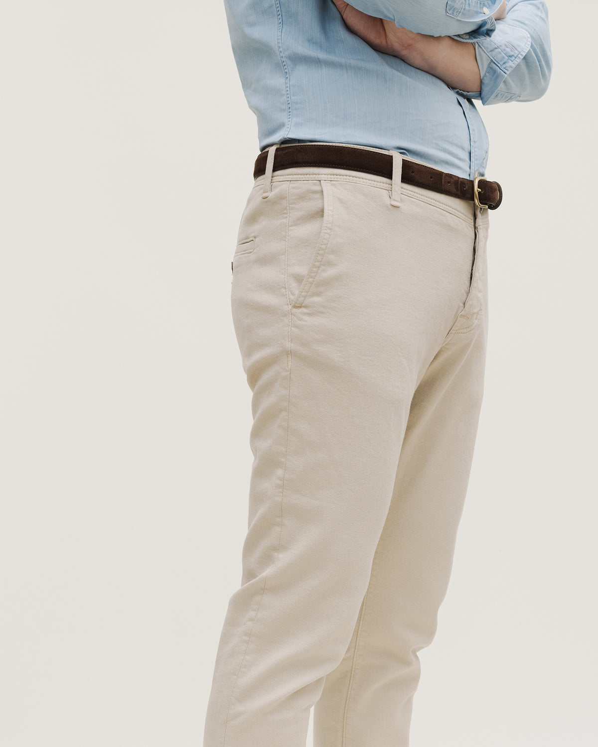 The Frontier Denim — coloured denim, light-coloured jeans, side view on a model