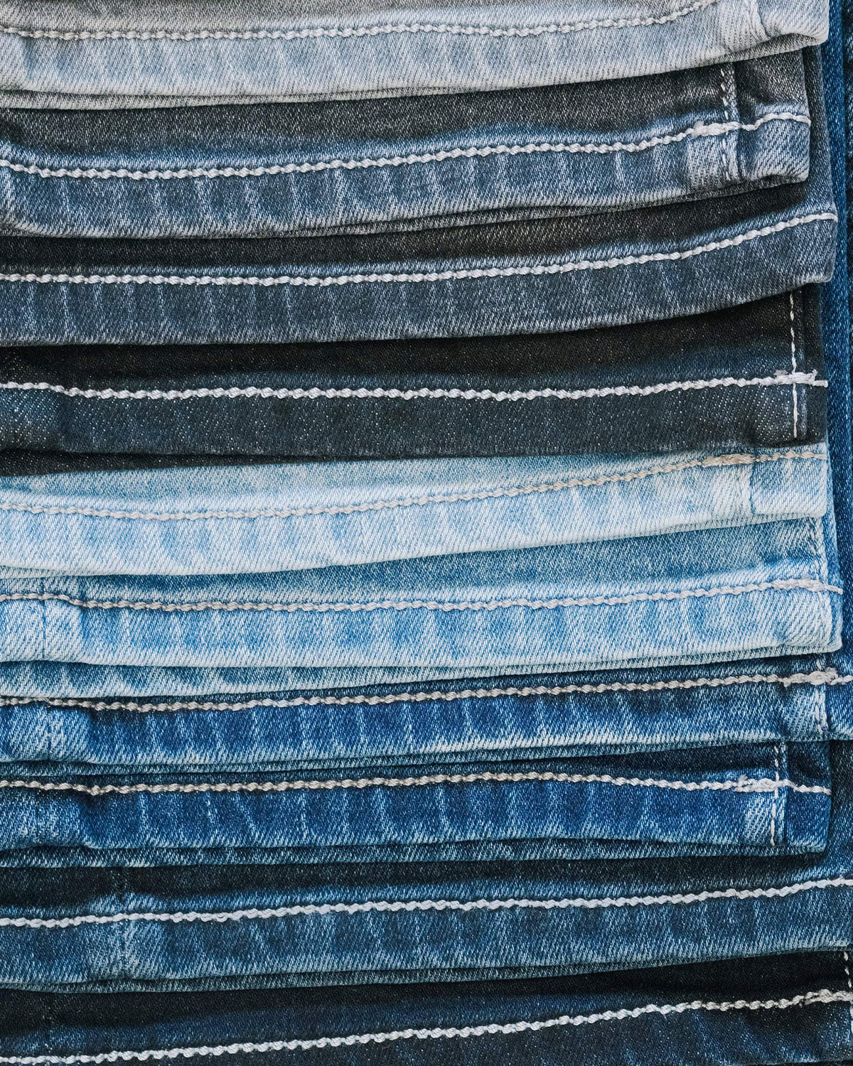 The Stretch Denim — denim, stacked denim swatches in several washes