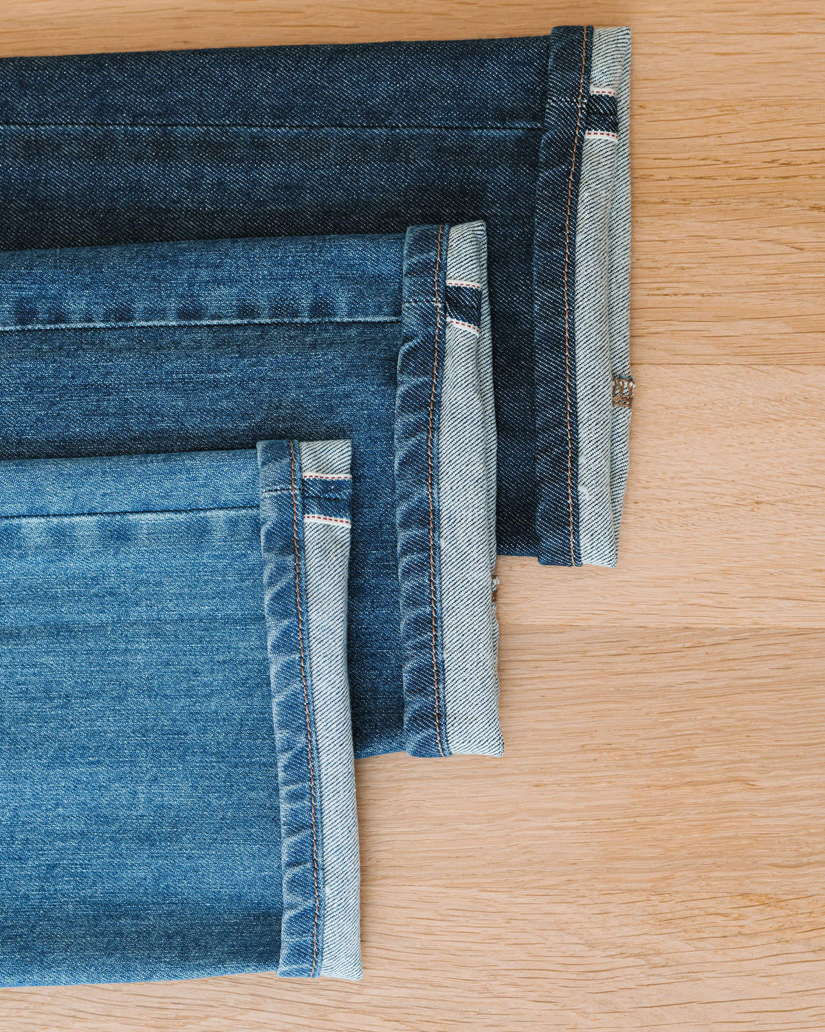 The Landmark Selvedge — blue denim, stacked blue denim swatches with selvedge edges