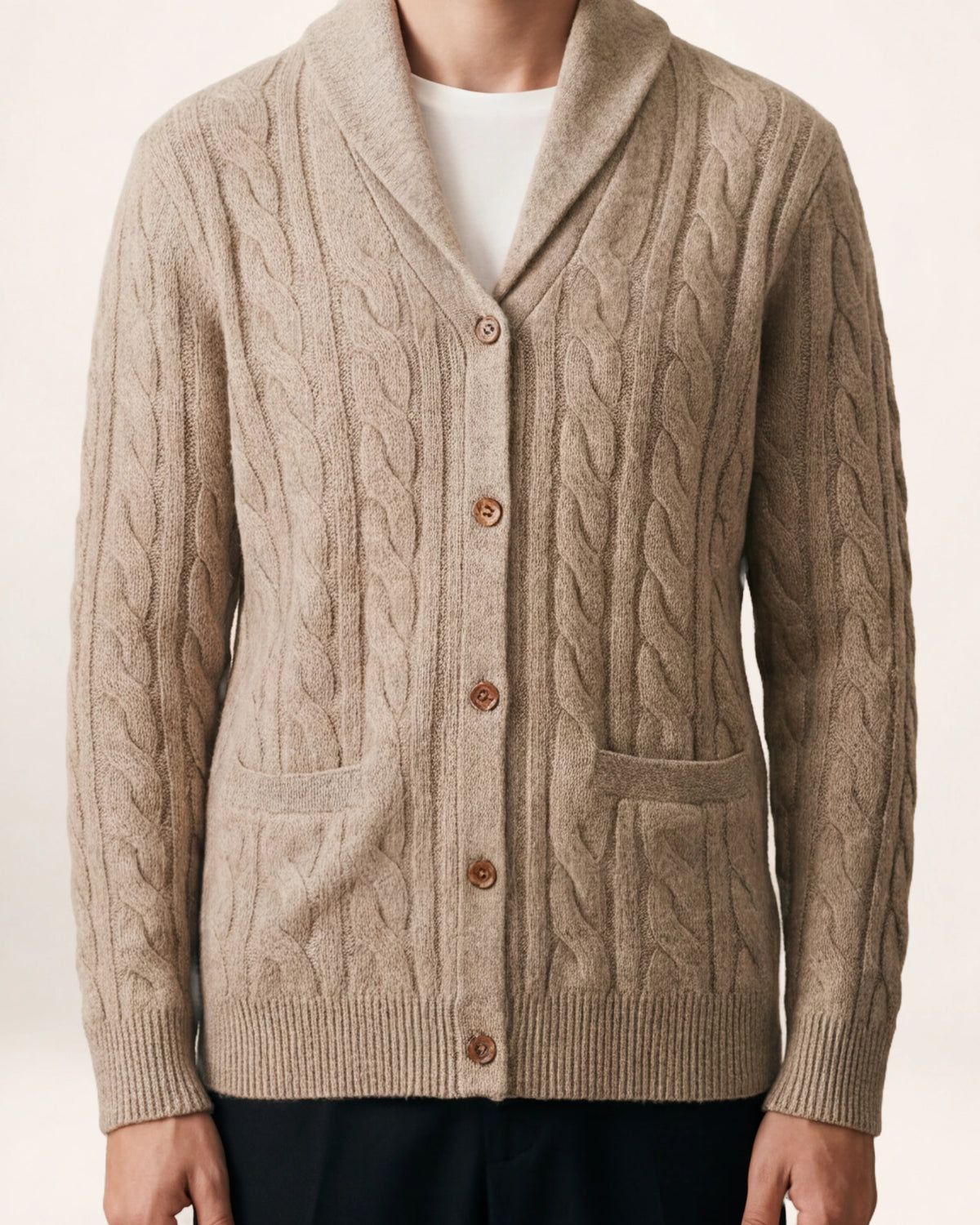 The Artisan Cardigan — oatmeal cable-knit cardigan, front view on a model