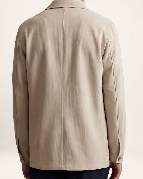 The Passage Jacket — beige button-front jacket, back view on a model