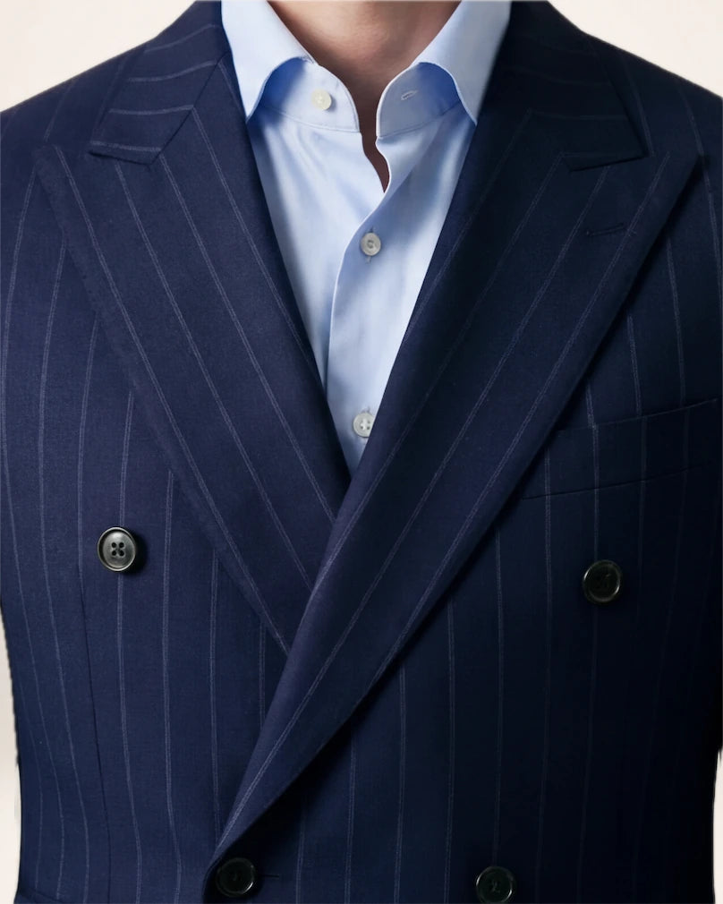 The Power Suit — navy pinstripe suit, double-breasted front and lapel detail