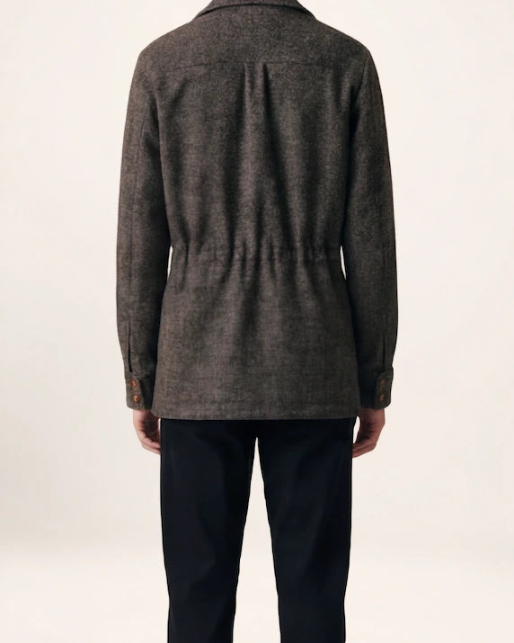 The Safari Jacket — charcoal jacket, back view on a model