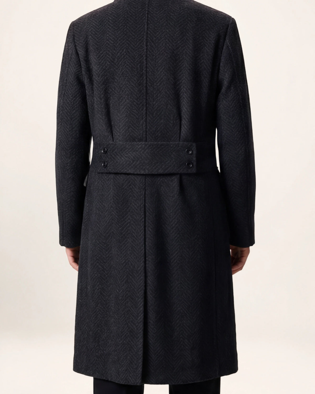 The Sovereign Coat — charcoal coat, back view on a model