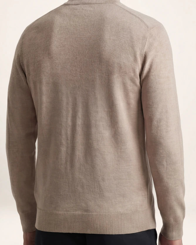 The Transit Knit — oatmeal zip knit, back view on a model