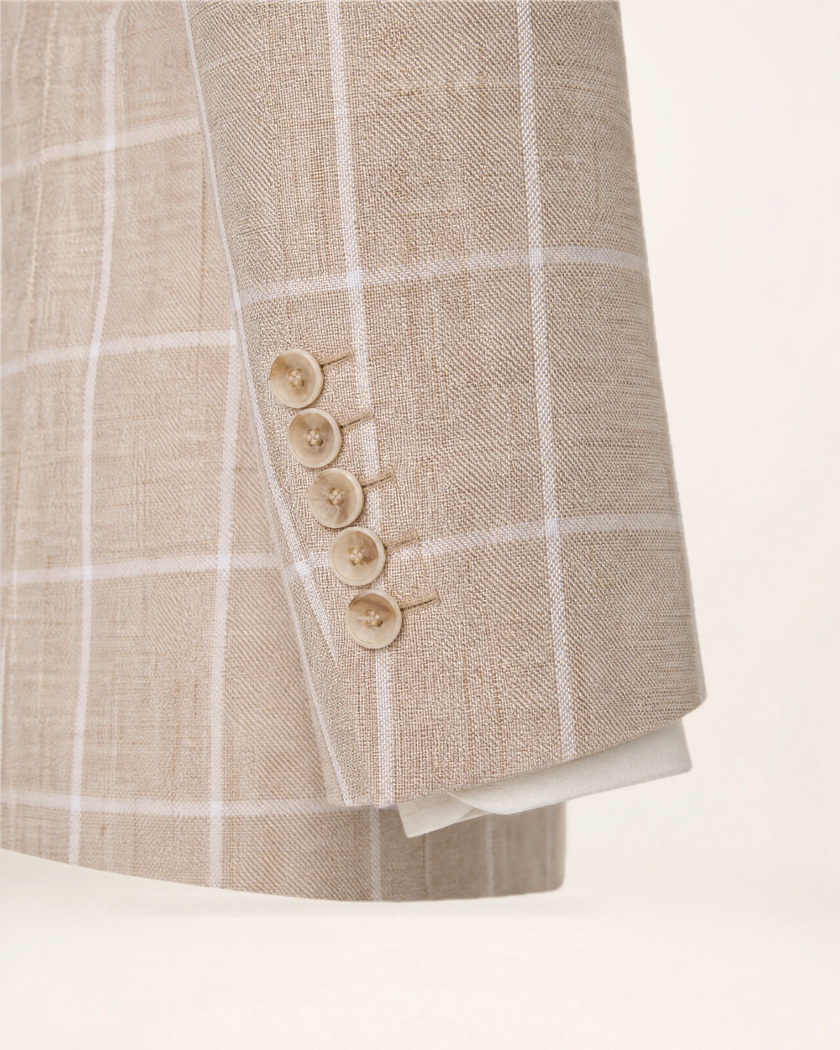 The Waypoint Jacket — beige checked jacket, sleeve button detail